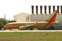 N764SW @ KAUS - SWA 73G still in old colors taxis to 35R. - by Darryl Roach