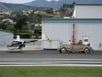 N2302J @ SZP - 1946 (sic) Robinson R22 BETA, Lycoming O-320, contrasting transportation modes - by Doug Robertson