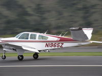 N1965Z @ SZP - 1965 Beech S35 BONANZA, Continental IO-520-B 285 Hp, tip tanks, landing roll Rwy 04 - by Doug Robertson