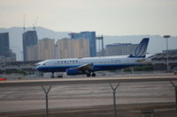 N479UA @ LAS - Positioning rwy 25R - by AJ Heiser