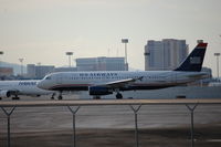 N628AW @ LAS - Positioning rwy 25R - by AJ Heiser
