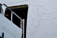 A6-GDP @ EGBP - Crews and engineers obviously had a great deal of affection for this aeroplane judging by the comments written around the entrance door. Quite sad really knowing this queen of the skies will never venture into the wild blue yonder again. - by moxy