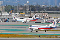 N382AE @ KLAX - American Eagle SAAB 340B, off of 25L at H-9 KLAX. - by Mark Kalfas