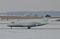 N225N @ CID - Taxiing to Runway 27, light snow falling - by Glenn E. Chatfield