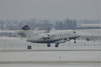 N225N @ CID - Departing Runway 27, light snow falling - by Glenn E. Chatfield
