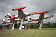 DT-923 @ EKBI - Lockheed T-33A. Ex USAF 51-8923 together with DT-289 & DT-497. The formating T-33 trio 'gate guardians' at the entrance to Mobilium, the Danish Air Museum, Billund in 1994. - by Malcolm Clarke