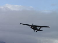 N756AL @ CCB - Taking off in the rain, wheels coming up - by Helicopterfriend