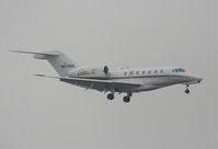 N970QS @ KLAX - Net Jets Citation X, N970QS short final 7R KLAX. - by Mark Kalfas