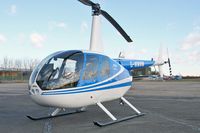 G-WMWM @ EGTC - Robinson R-44 Raven at Cranfield Airport in 2006. - by Malcolm Clarke