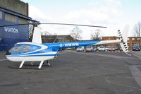 G-WMWM @ EGTC - Robinson R-44 Raven at Cranfield Airport in 2006. - by Malcolm Clarke