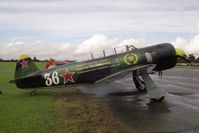 G-KYAK @ EGSX - Yak C-11 at a North Weald Photoshoot in 1999. - by Malcolm Clarke