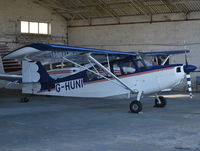 G-HUNI @ EGLD - Bellanca 7GCBC hangared at Denham - by moxy