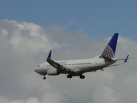 N17719 @ ONT - Approaching 26R over the outer fence perimeter - by Helicopterfriend