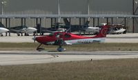 N628EC @ KAPF - Departing runway 32 - by Kreg Anderson