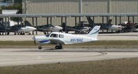 N978AC @ KAPF - Departing runway 32 - by Kreg Anderson