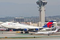 N671US @ KLAX - Delta Airlines Boeing 747-451, N671US, DAL283 25R departure en route to RJAA (Narita Int'l). - by Mark Kalfas