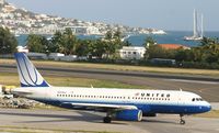 N411UA @ TNCM - United N411UA taxing to alpha for take off