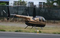 N740RK @ TNCM - N740RK park at the helipad at TNCM