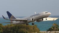 N13718 @ TNCM - Continental N13718 departing TNCM runway 28