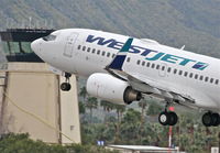 C-FIWJ @ KPSP - WESTJET Boeing 737-7CT, WJA1469 to CYYC, 13R departure KPSP. - by Mark Kalfas