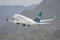 C-FIWJ @ KPSP - WESTJET Boeing 737-7CT, WJA1469 to CYYC, 13R departure KPSP. - by Mark Kalfas