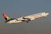 ZS-SJG @ FAJS - Boeing 737-8BG [32353] (South African Airways) Johannesburg~ZS 19/09/2006. Seen departing .Taken through the glass of the terminal. - by Ray Barber