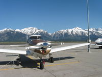 N4549K @ KJAC - Jackson Hole Grand Tetons Back Drop - by Bart Bartelsman