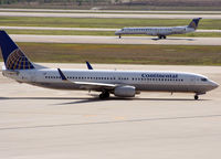 N37409 @ KIAH - A COA B739 taxis next to a departing company ERJ. - by Darryl Roach