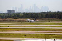 N37409 @ KIAH - B739 rotates on 15R with downtown as a backdrop. - by Darryl Roach