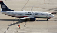N305AW @ KIAH - B733 is guided into the gate. - by Darryl Roach