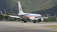 N668AA @ TNCM - American Airlines just landed at TNCM and rolling out to the end of the runway 10!!!