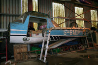 G-BAOP @ EGSM - Stored with G-AVPH on the wall - by N-A-S