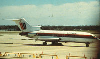 N7414U @ KMSP - United 727 QC. Scanned from print.
