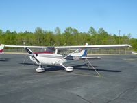 N738MT @ RUQ - At rest - by John W. Thomas