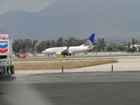 N14704 @ ONT - Turning off of Runway 26R at taxiway K - by Helicopterfriend