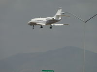 N602LP @ ONT - Over the outer fence to runway 26R - by Helicopterfriend