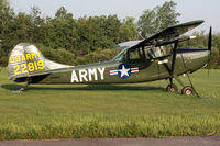 N269TH @ ANE - Cessna 305A, c/n: 22819, outside after the museum was evicted. - by Timothy Aanerud