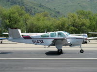 N143K @ SZP - 1964 Beech S35 BONANZA, Continental IO-520-B 285 Hp, landing roll Rwy 22 - by Doug Robertson