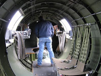 N5017N @ OXR - 1944 Boeing B-17G Flying Fortress 'Aluminum Overcast' , waist machine guns-six foot man shows area size. Looking forward. - by Doug Robertson