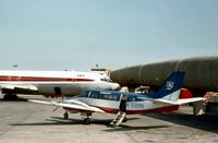 N7099N @ JFK - Beech 99 of Monmouth Airlines of Farmingdale at the terminal gate at Kennedy in the Summer of 1977. - by Peter Nicholson