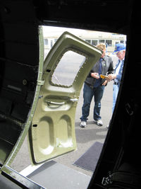 N5017N @ OXR - 1944 Boeing B-17G Flying Fortress 'Aluminum Overcast', rear tour exit door - by Doug Robertson