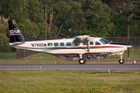 N786DM @ ORF - Certified Aviation Services 2001 Cessna 208B Grand Caravan N786DM starting takeoff roll on RWY 23 from intersection Foxtrot. Looking closely, the guy in the back also has a control stick. Interesting to note is the clear cargo hold and it's contents. - by Dean Heald