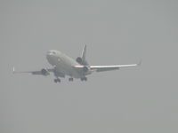 N285UP @ ONT - Out of the fog from Honolulu, Hawiia and on final to runway 26L - by Helicopterfriend