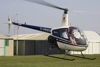 G-HBMW @ X5FB - Robinson R-22 at Fishburn Airfield, UK in 2010. - by Malcolm Clarke