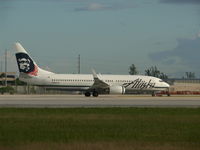 N584AS @ KMIA - wearing hawaiian flowers