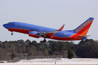 N241WN @ ORF - Southwest Airlines N241WN departing RWY 5 with a significant snow on the ground by Norfolk's standards.