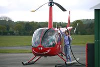 G-JEFA @ EGBO - 2000 Robinson Helicopter Co Inc ROBINSON R44 refeuling at Wolverhampton on 2010 Wings and Wheels Day - by Terry Fletcher