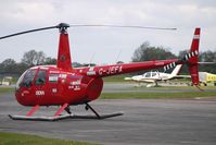 G-JEFA @ EGBO - 2000 Robinson Helicopter Co Inc ROBINSON R44 at Wolverhampton on 2010 Wings and Wheels Day - by Terry Fletcher