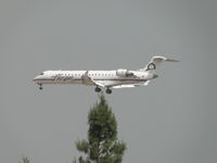 N606QX @ ONT - Over the threshold for runway 26R - by Helicopterfriend
