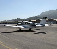 N599DS @ SZP - 1967 Beech E33A BONANZA, Continental IO-520-B 285 Hp, taxi - by Doug Robertson